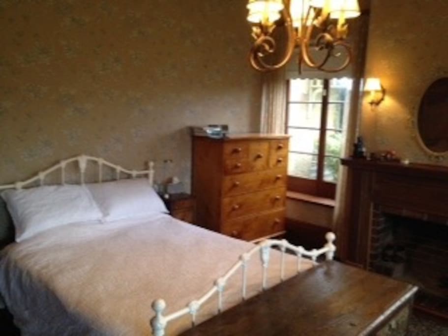 Master Queen bedroom with Huon Pine chest & fireplace
