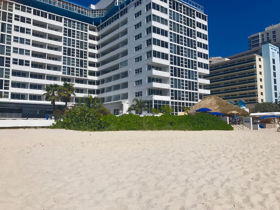 Beautiful white sandy private beach in front of your hotel. Tiki bar/restaurant to the right.