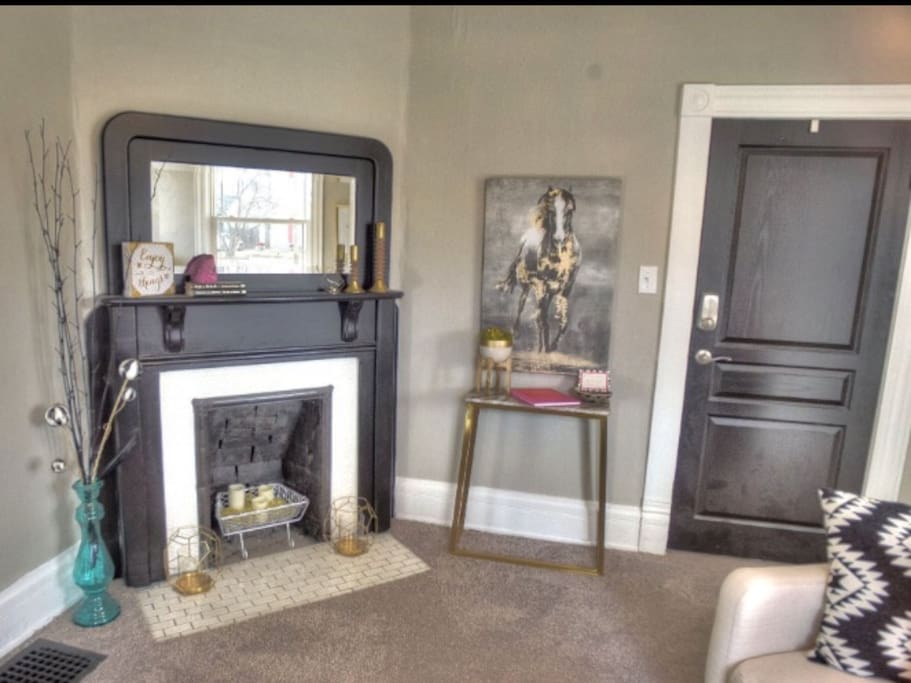 Enjoy the warm glow of our cool candle lit fireplace.