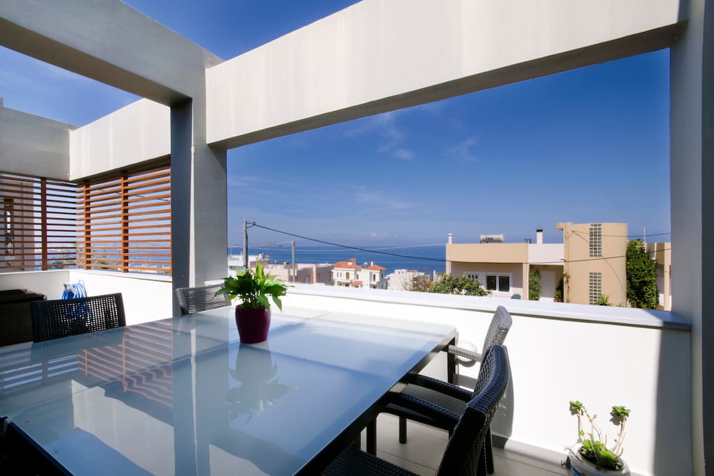Large patio with dinning area to enjoy the endless sea view and the view of Chania.