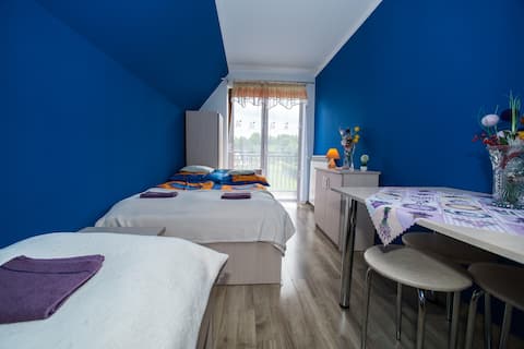 Comfortable room with bathroom, TV, and balcony