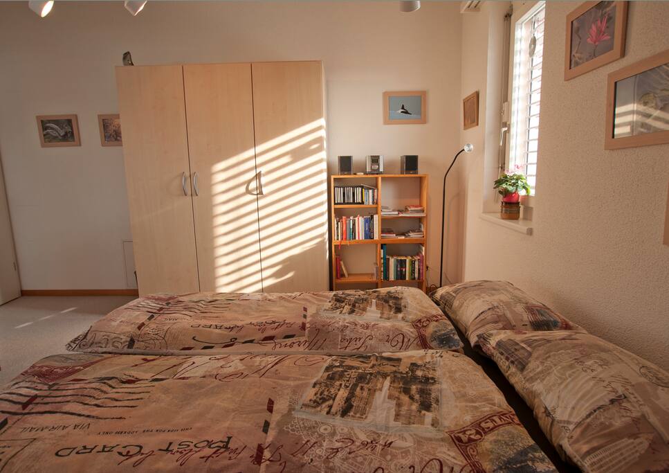 Your room with cupboard, radio, books, second window.