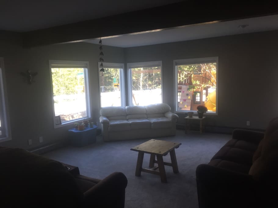 Shared living room that you walk through to get to your personal area - great windows!