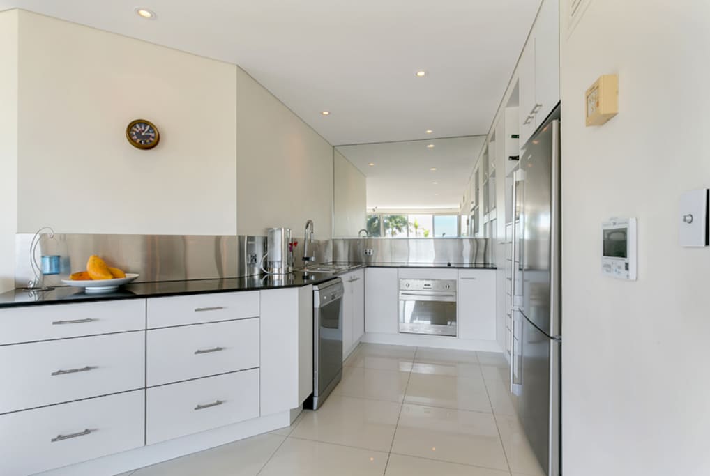 Fully equipped kitchen with oven, full size fridge, stove, dishwasher and all cutlery/crockery required to cook a delicious meal.