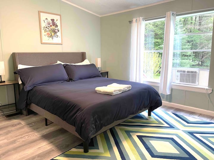 Bedroom with queen bed. 