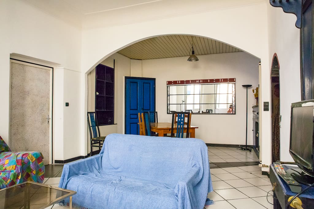 Living room seen from the windows' side (3rd toilet behind the blue doors).