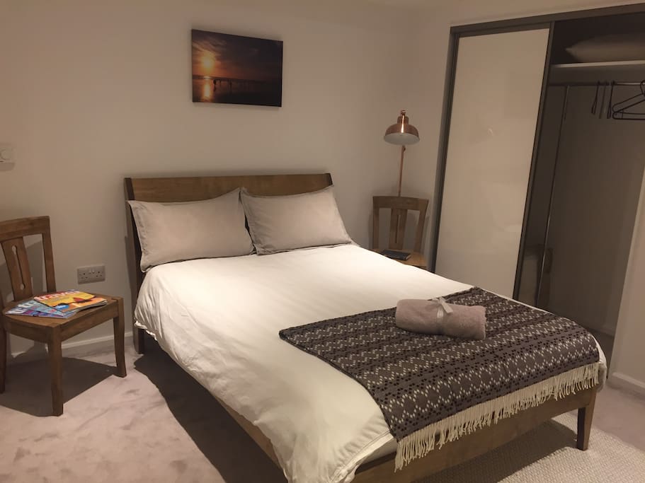 Warm spacious bedroom with luxury double bed