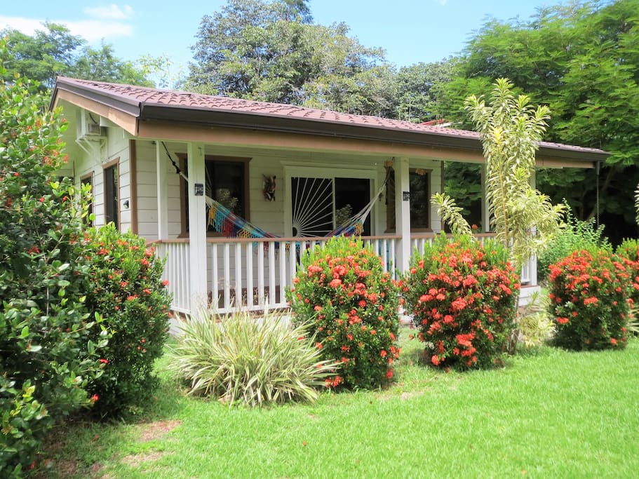 From the cottage balcony you will enjoy a colorful river, jungle and garden view.