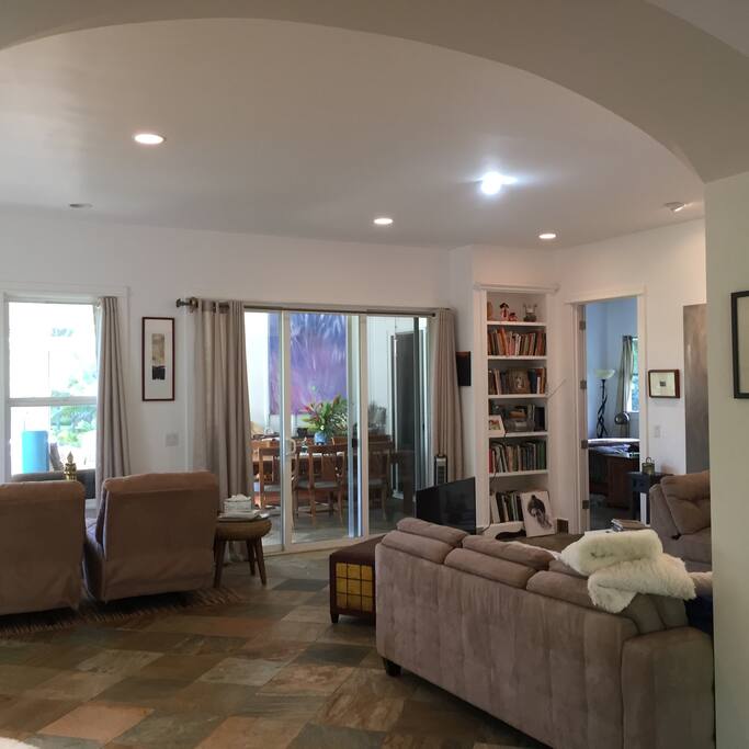 Living room, with views to the expansive 2 acre estate - papaya, palms, passion fruit, guava and more!