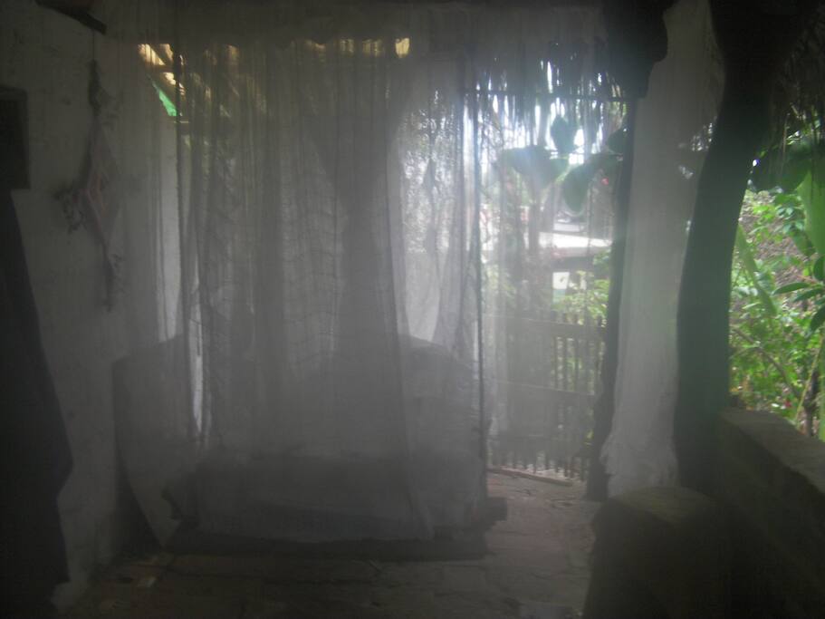 The White curtained Cuarto Jardin with Mosquito net