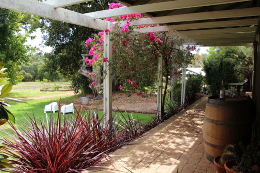 Your Verandah, with table & chairs, sofa and baby Weber-Q BBA