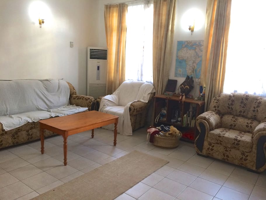 Large, open sitting area with comfortable furniture, lots of light, and standing A/C