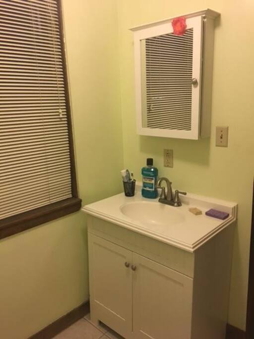 Clean and quaint bathroom next to the patio