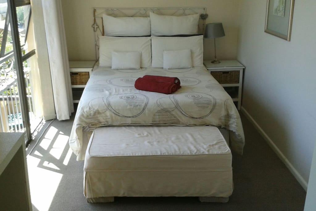 Main bedroom wit double bed and dressing room area.