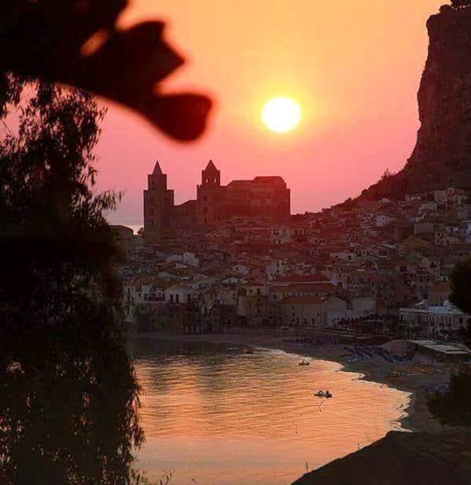 Cathedral and overview of the historic center of Cefalù at sunset
