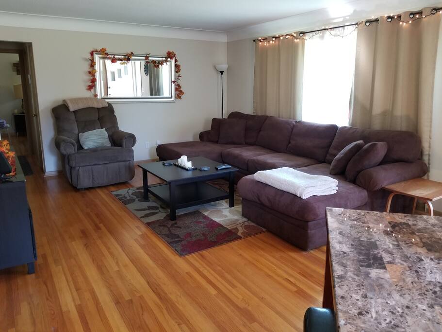 Comfy, spacious, Living room with large couch and lounge chair