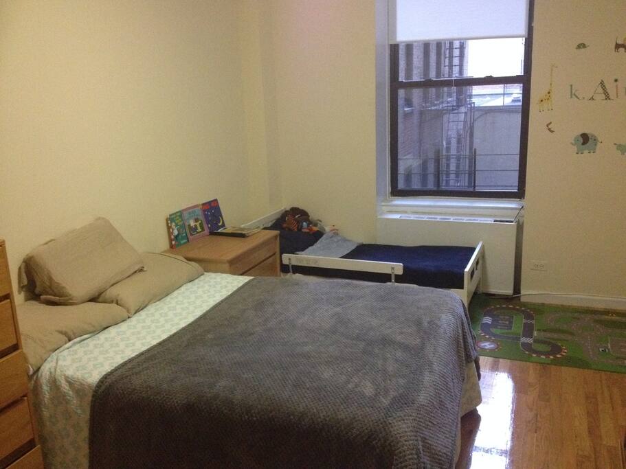 Queens bed, toddler bed, electronic drumkit (out of shot)