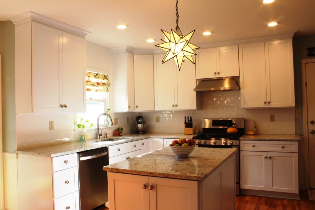 Beautiful kitchen with granite countertops and white subway tile backsplash