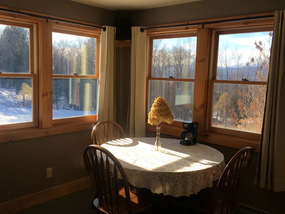 Plenty of sunlight, windows to the left look out over the pond and to the right looks out to Mt. Mansfield.