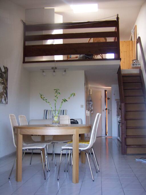 The living room with the mezzanine above.