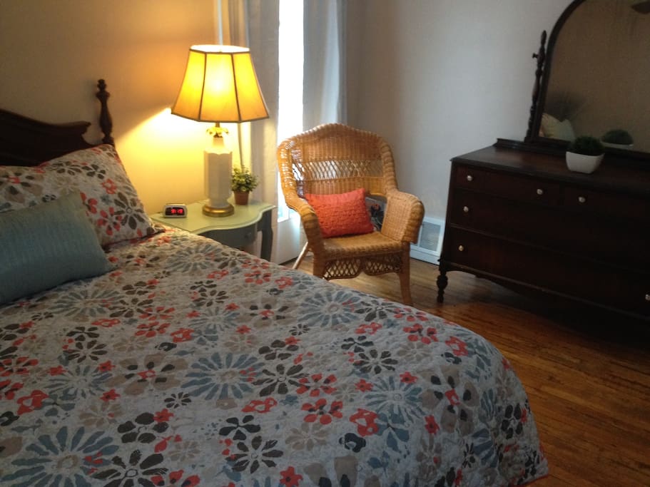 Master bedroom with armoire and seating area