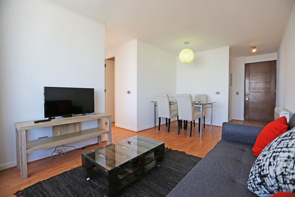 Living room with Smart TV and dining room