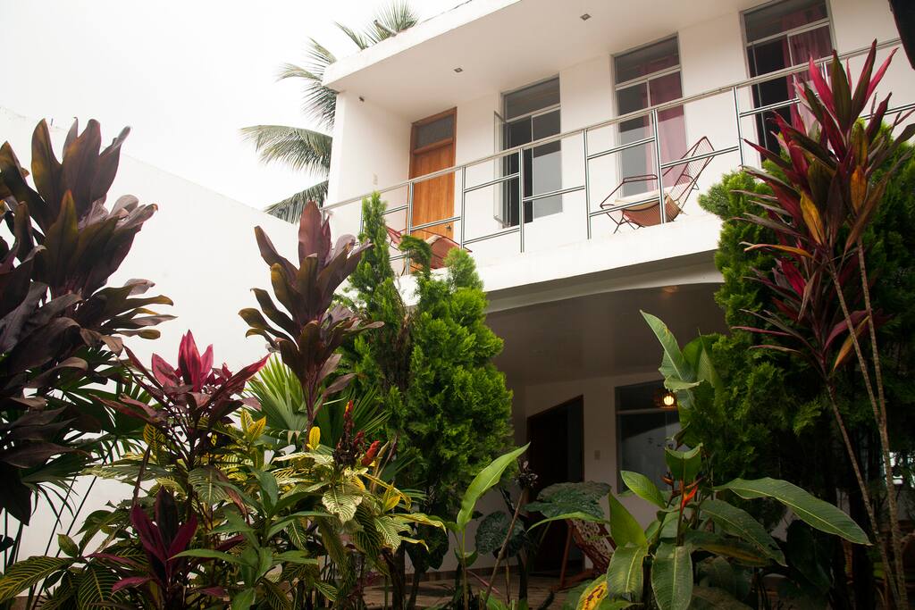 House facade, access via the garage and garden