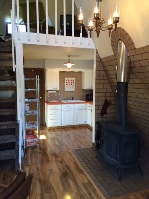 Open floor plan with wood stove.