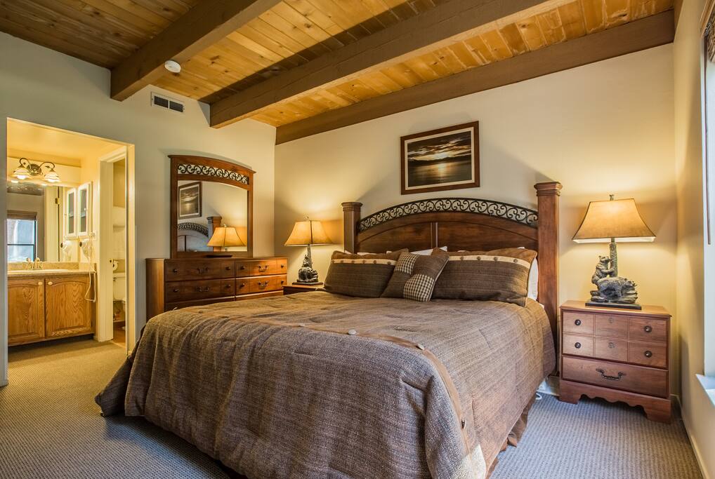 Master bedroom on the entry level, king bed, private bathroom