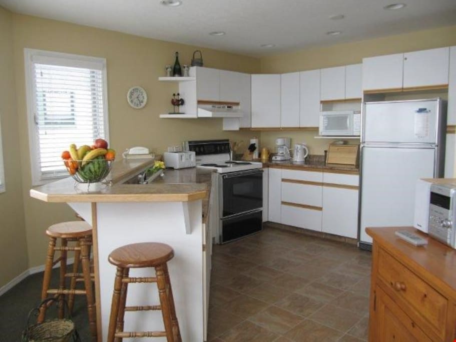 Prepare meals in the privacy of your own suite with the fully equipped kitchen, plus breakfast bar and stools.