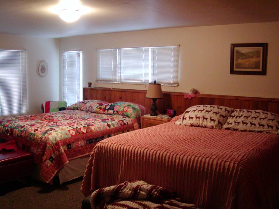 Large bright bedroom with 2 queen beds.