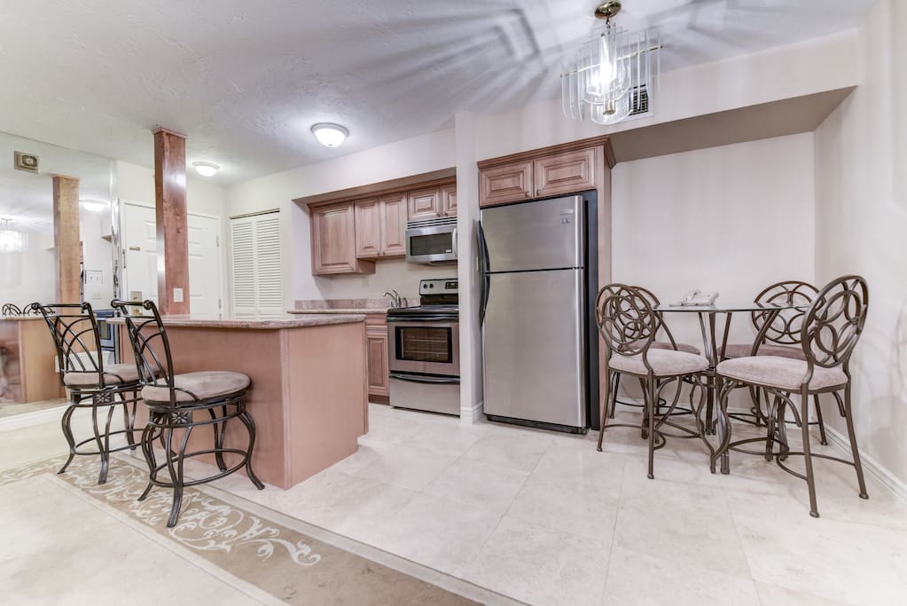 Eat-in kitchen with seating around table and counter