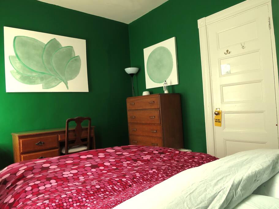 Desk with chair and full sized bed with a white noise maker for the soundest of sleep.