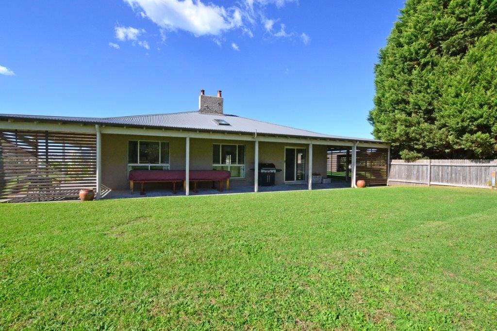 Renovated, spacious farmhouse with verandah all round, set on huge lawns.