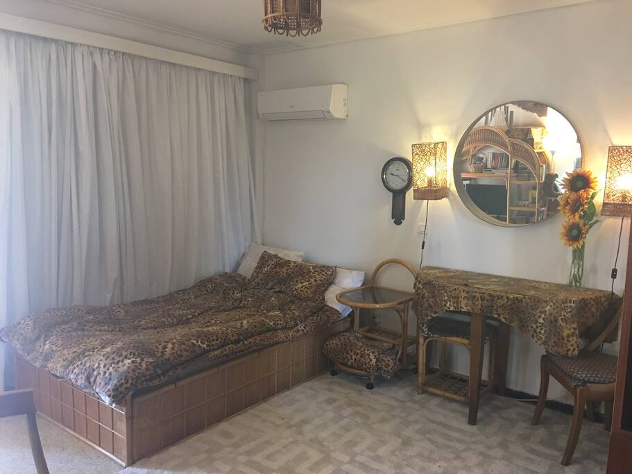 A queen comfortably beds two people.