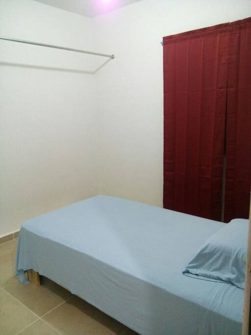 Bedroom with 2 single beds and closet. There is another bedroom with a double bed.