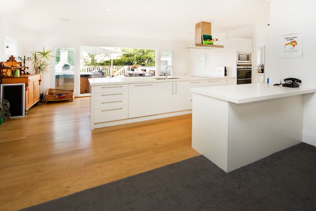 Kitchen with view of dining and outside living