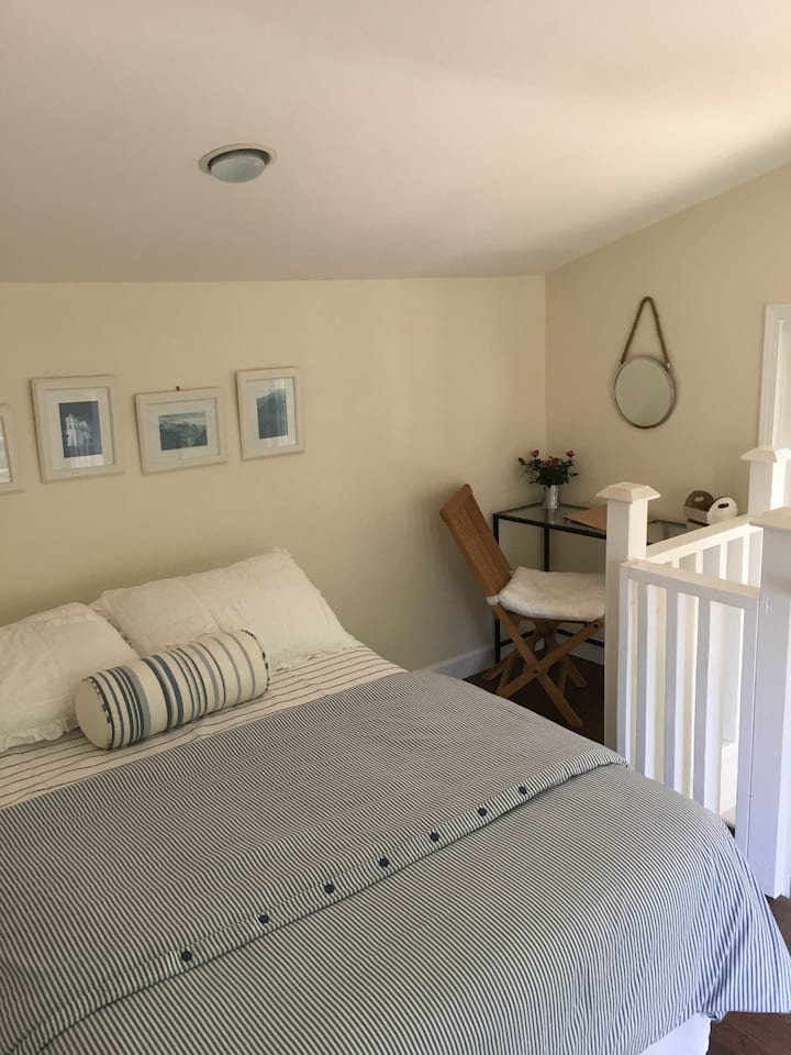 Queen size bed with new tuft and needle mattress and down comforter. 