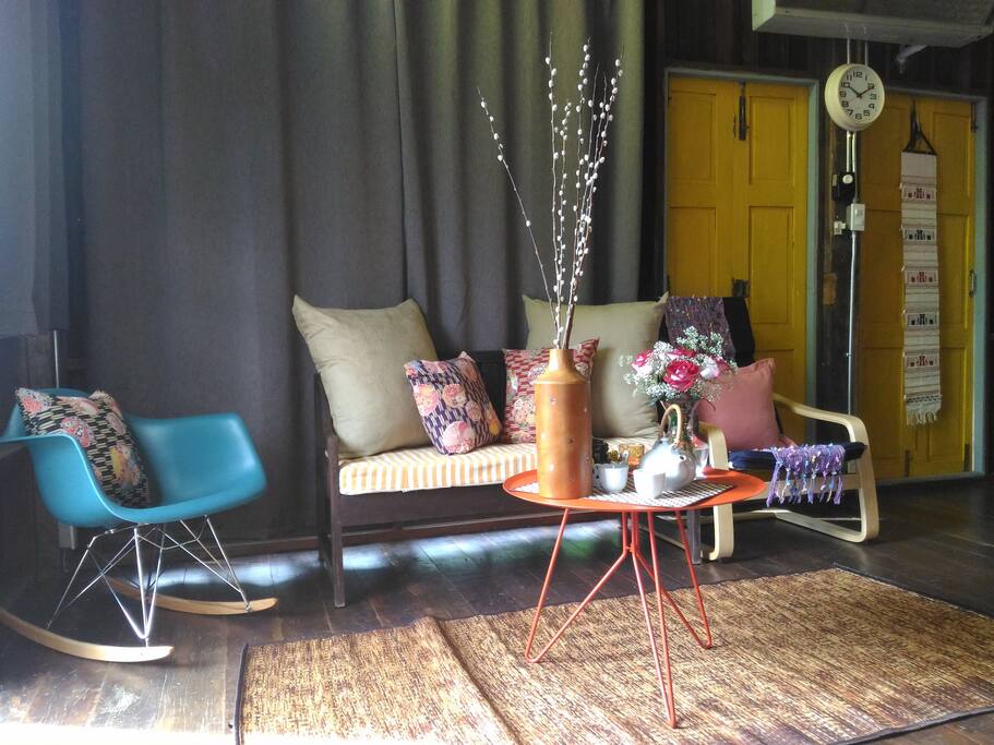 Living area with designer rocking chair and arm chair