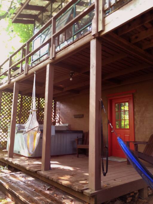 Closer view of entrance, hot tub, and deck.