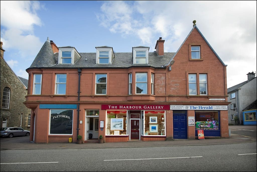 Our flat is above the paper shop on the right side (facing the building) of the building.