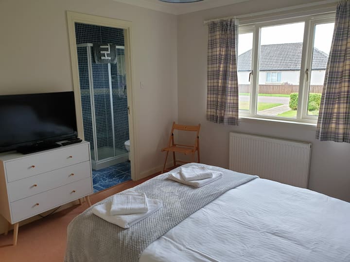 Master bedroom with en suite at the front of the house.