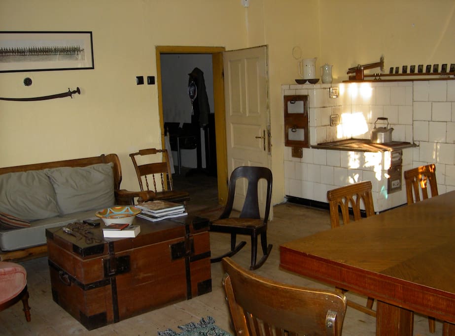 Sitting area in the Stone house living room, with wood stove