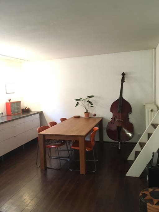 The kitchen is big and has space for several people eating and cooking.