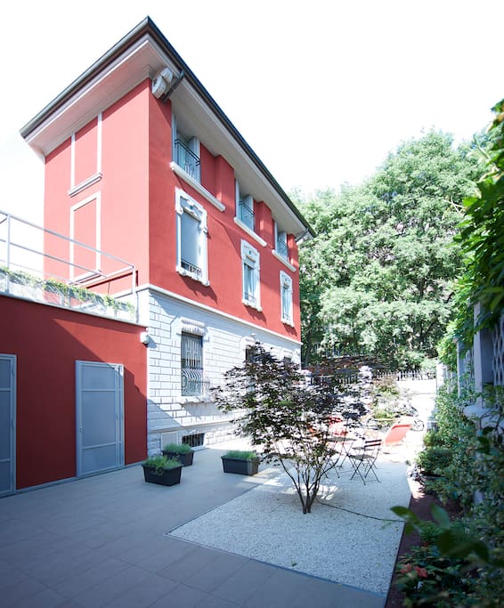 Yellow flat top floor has 4 little balconies looking at the garden!