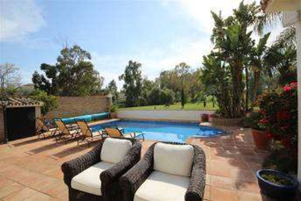 View of pool and comfy seating
