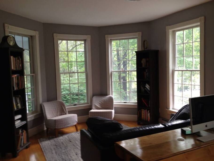 Sunny front room with Piano and game table