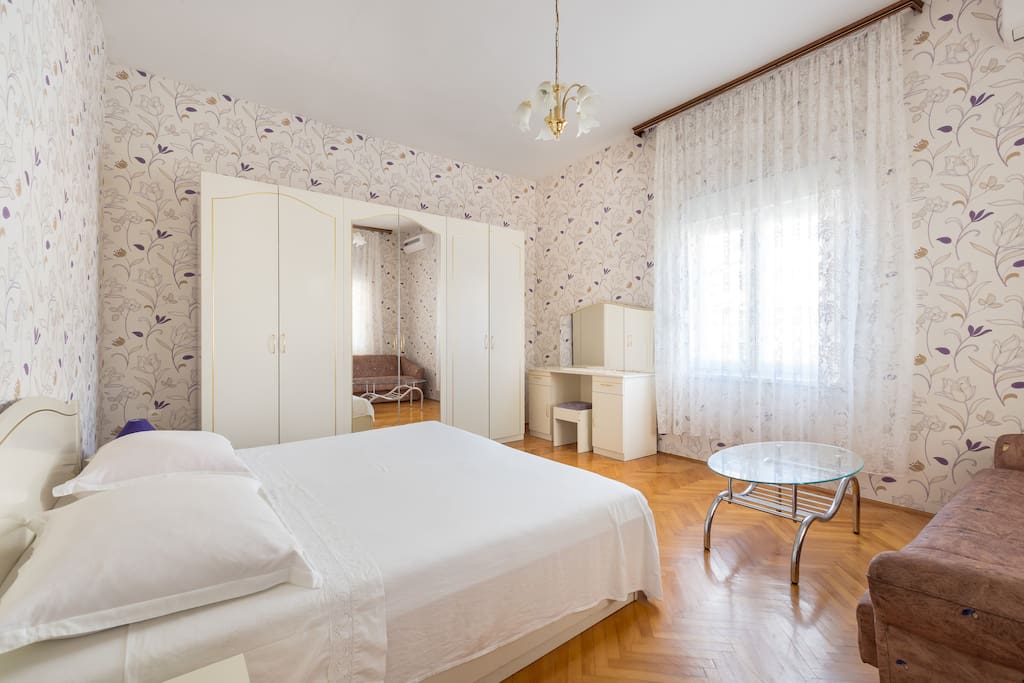 Bedroom with king size bed and extra sofa