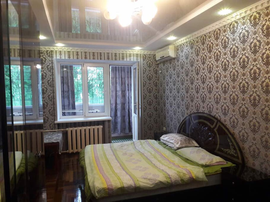 Balcony from bedroom with big windows and beautiful view on Manas'a avenue