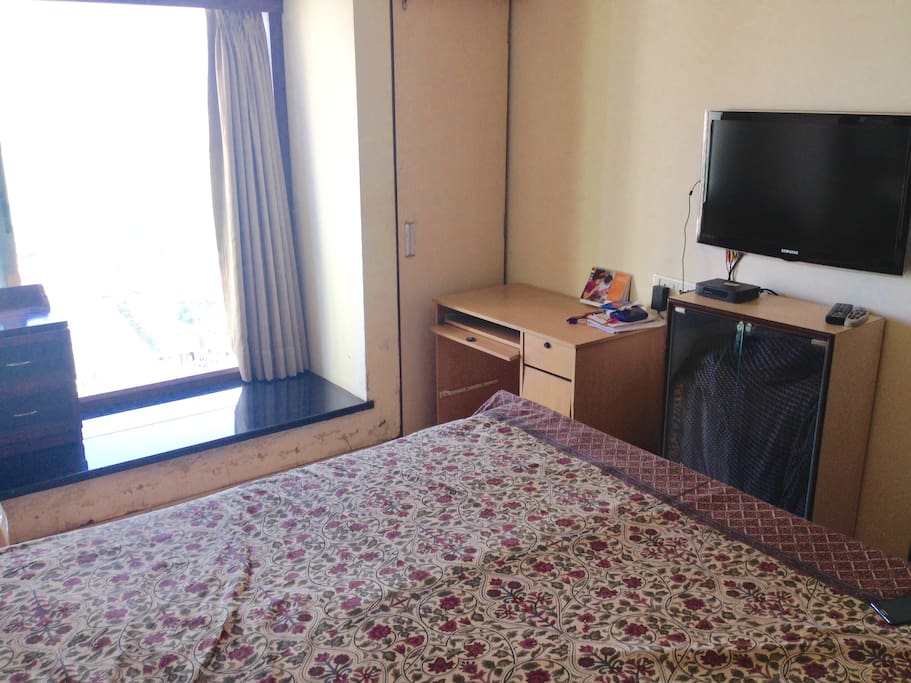 Room with Television and study table